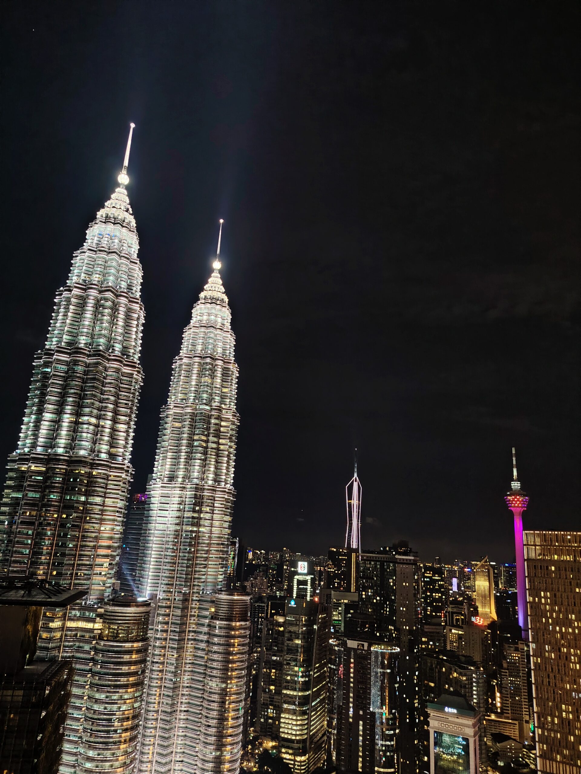 Petronas Twin Towers Kuala Lumpur at night, one of Malaysia's most iconic tourist attractions. Discover Malaysia travel destinations, attractions, hotels, tourist guides, travel packages, tickets and tourism experiences with TravelMall.my, Malaysia's Homegrown Travel Marketplace.